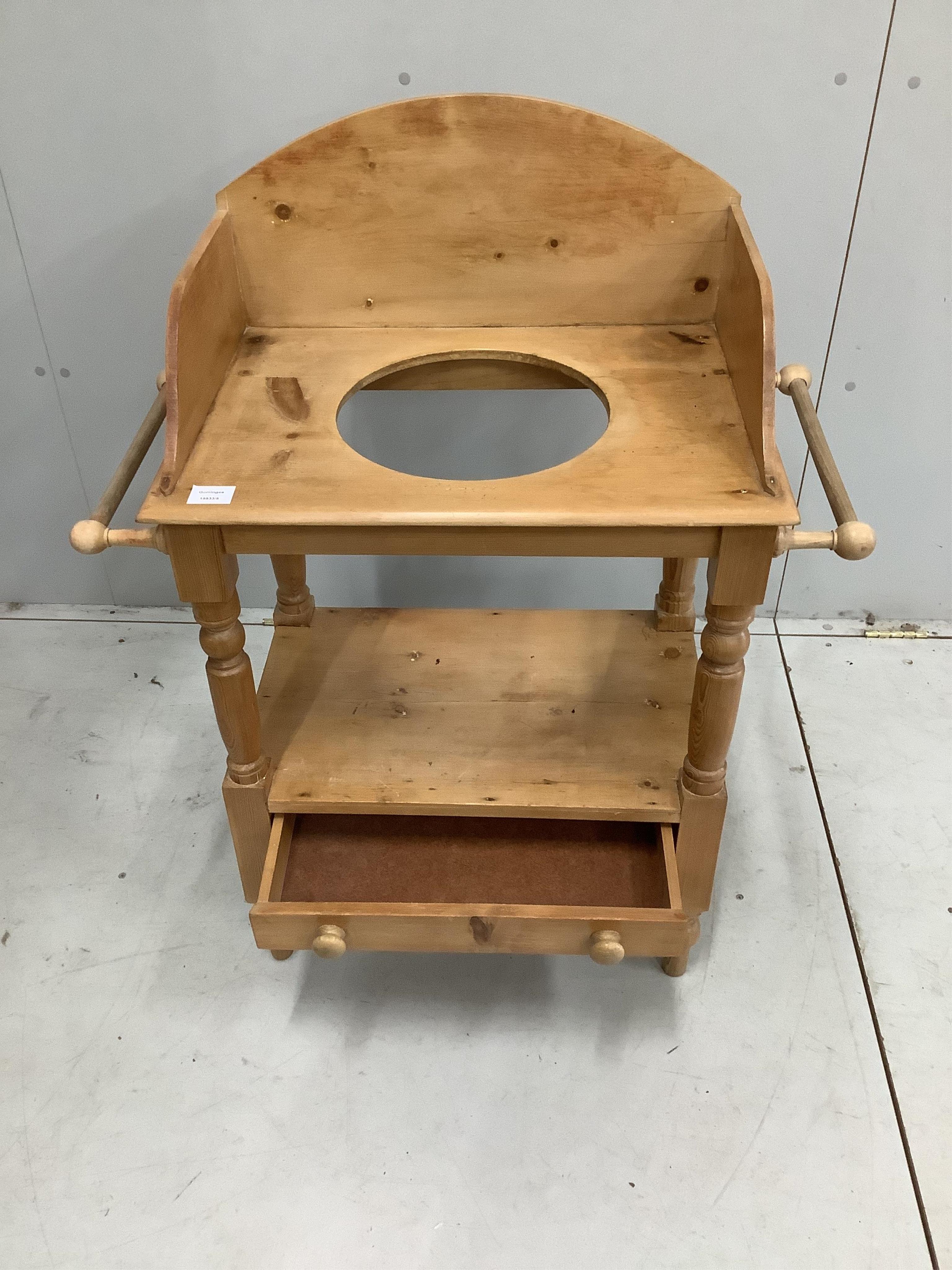 An Edwardian style pine washstand, width 77cm. Condition - faded with some cracks